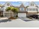 Charming townhome featuring a two-car garage and well-manicured landscaping in a desirable community at 565 Stone Field Nw Run, Marietta, GA 30060