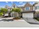 Inviting townhome with a two-car garage and appealing landscaping in a well-maintained neighborhood at 565 Stone Field Nw Run, Marietta, GA 30060
