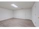 Finished basement with vinyl floors, neutral walls, and a white door at 1100 Kensington Ct, Johns Creek, GA 30022
