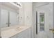 Bathroom featuring a vanity with a large mirror and access to an adjacent room at 1100 Kensington Ct, Johns Creek, GA 30022