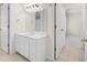 Bright bathroom featuring a single sink and a closet at 1100 Kensington Ct, Johns Creek, GA 30022