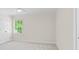 Bedroom with neutral walls, carpeted floors, and a window with natural light at 1100 Kensington Ct, Johns Creek, GA 30022