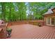 Spacious wooden deck offering an inviting outdoor space with decorative flowerpots at 1100 Kensington Ct, Johns Creek, GA 30022