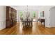 Bright dining room with hardwood floors, traditional decor, and backyard views at 1100 Kensington Ct, Johns Creek, GA 30022
