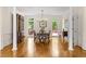 Dining room with hardwood floors, natural light, and traditional furnishings at 1100 Kensington Ct, Johns Creek, GA 30022