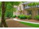 Stately brick home with manicured landscaping and inviting front entrance at 1100 Kensington Ct, Johns Creek, GA 30022