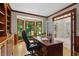 Well-appointed office space with large windows, custom cabinets, and hardwood floors at 1100 Kensington Ct, Johns Creek, GA 30022