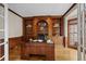 Elegant home office with custom built-ins, hardwood floors, and natural light at 1100 Kensington Ct, Johns Creek, GA 30022