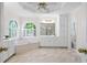 Relaxing main bathroom with a soaking tub, natural light, and separate shower area at 1100 Kensington Ct, Johns Creek, GA 30022