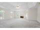 Spacious main bedroom with a fireplace, tray ceiling, and lots of windows at 1100 Kensington Ct, Johns Creek, GA 30022