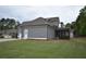 Spacious backyard with well-maintained lawn and screened-in porch of a two-story gray sided home at 15 Worthington Dr, Villa Rica, GA 30180