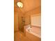 Bathroom featuring a bathtub with a window, and a glass-doored shower at 15 Worthington Dr, Villa Rica, GA 30180