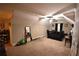 Spacious bedroom featuring neutral walls, carpet floor, ceiling fan, and a bed with black bedding at 15 Worthington Dr, Villa Rica, GA 30180