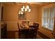Formal dining room featuring a large mirror, wainscoting, and chandelier lighting at 15 Worthington Dr, Villa Rica, GA 30180