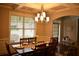 Formal dining room featuring a coffered ceiling, wainscoting and a window with blinds at 15 Worthington Dr, Villa Rica, GA 30180