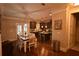 Open-concept kitchen with stainless appliances, granite counters, and adjacent dining area at 15 Worthington Dr, Villa Rica, GA 30180