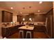 Modern kitchen offers granite counters, stainless appliances, and center island with seating at 15 Worthington Dr, Villa Rica, GA 30180
