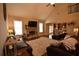 Cozy living room boasts vaulted ceiling, stone fireplace, and open layout at 15 Worthington Dr, Villa Rica, GA 30180