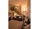 Elegant living room boasts soaring ceilings, a cozy fireplace, and an open staircase at 15 Worthington Dr, Villa Rica, GA 30180