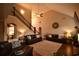 Spacious living room with a high ceiling, wood floors and a staircase with iron railing at 15 Worthington Dr, Villa Rica, GA 30180