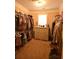 A walk-in closet with ample hanging space and a dresser against the wall at 15 Worthington Dr, Villa Rica, GA 30180