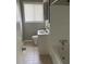 Bathroom features tiled shower, toilet, vanity and window with blind at 1685 Pheasant Dr, Jonesboro, GA 30238