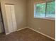 Neutral bedroom with carpet, closet and window with blind at 1685 Pheasant Dr, Jonesboro, GA 30238