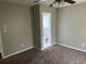 Bedroom with ensuite bathroom and carpet flooring at 1685 Pheasant Dr, Jonesboro, GA 30238