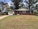 Charming single-story home with brick accents, attached garage, and a well-maintained lawn at 1685 Pheasant Dr, Jonesboro, GA 30238