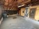 Spacious garage with exposed rafters and painted floor at 1685 Pheasant Dr, Jonesboro, GA 30238