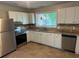 Well-lit kitchen featuring stainless steel appliances and ample counter space at 1685 Pheasant Dr, Jonesboro, GA 30238