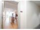 Condo hallway view to unit 815 leading into a kitchen with wood floors and stainless appliances at 3040 Peachtree Nw Rd # 815, Atlanta, GA 30305