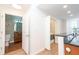 Hallway view showcasing access to the bathroom, in-unit laundry, and kitchen at 3040 Peachtree Nw Rd # 815, Atlanta, GA 30305