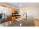 Granite countertops highlight this kitchen with stainless steel appliances and stylish wooden cabinets at 3040 Peachtree Nw Rd # 815, Atlanta, GA 30305