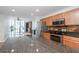 Open kitchen features wood cabinets, stainless steel appliances, black countertops, and an open concept at 3040 Peachtree Nw Rd # 815, Atlanta, GA 30305