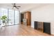 Spacious living room with floor-to-ceiling windows and a decorative fireplace feature at 3040 Peachtree Nw Rd # 815, Atlanta, GA 30305