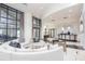 Bright, spacious lobby area with comfortable seating, large windows, and a welcoming reception desk at 3040 Peachtree Nw Rd # 815, Atlanta, GA 30305