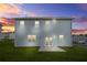 Two-story home with well maintained lawn and patio at sunset in the backyard at 3135 Ellenton Dr, Lithia Springs, GA 30122