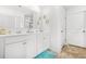 Bright bathroom features dual sinks, white cabinets, and stylish decor at 3135 Ellenton Dr, Lithia Springs, GA 30122
