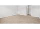 Bright bedroom featuring neutral carpet and an adjacent closet ready to be personalized at 3135 Ellenton Dr, Lithia Springs, GA 30122