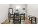 Cozy dining room featuring a table with seating for four, plus bench seating, complemented by wood-look flooring at 3135 Ellenton Dr, Lithia Springs, GA 30122