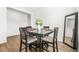 Cozy dining room featuring a table with seating for four, dark accents and complemented by wood-look flooring at 3135 Ellenton Dr, Lithia Springs, GA 30122