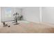This exercise room has carpet floors, natural light from the window, and workout equipment at 3135 Ellenton Dr, Lithia Springs, GA 30122