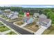 Suburban two-story home with light-blue siding, shutters, attached garage, and a well-manicured lawn on a neighborhood street at 3135 Ellenton Dr, Lithia Springs, GA 30122