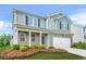 Attractive two-story home with brick and siding exterior, featuring a well-kept lawn and an attached two-car garage at 3135 Ellenton Dr, Lithia Springs, GA 30122