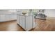 Kitchen island complements an open floor plan with view to the living room at 3135 Ellenton Dr, Lithia Springs, GA 30122
