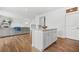 Kitchen island complements an open floor plan with view to the living room at 3135 Ellenton Dr, Lithia Springs, GA 30122