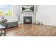 Bright living room featuring a fireplace, TV, and ample natural light at 3135 Ellenton Dr, Lithia Springs, GA 30122