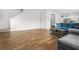 Bright living room with hardwood flooring, a large grey sofa, and recessed lighting at 3135 Ellenton Dr, Lithia Springs, GA 30122