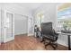 Office space featuring hardwood floors, large windows, and French doors that help with privacy at 3135 Ellenton Dr, Lithia Springs, GA 30122